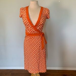 H&M Wrap Dress in Orange with white circles.